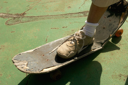 Foot on broken skateboardの写真素材