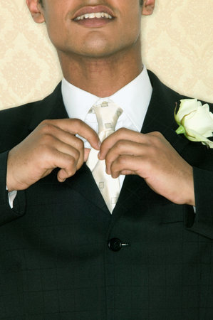 Bridegroom adjusting necktieの写真素材