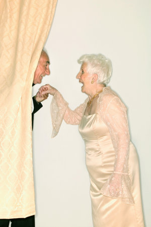 Man kissing a senior womans handの写真素材