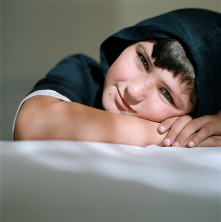 Smiling boy wearing a hoodの写真素材