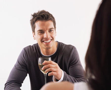 Man and woman having wineの写真素材