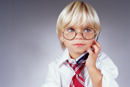 Boy on a mobile phoneの写真素材
