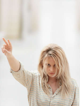 Woman making peace signの写真素材