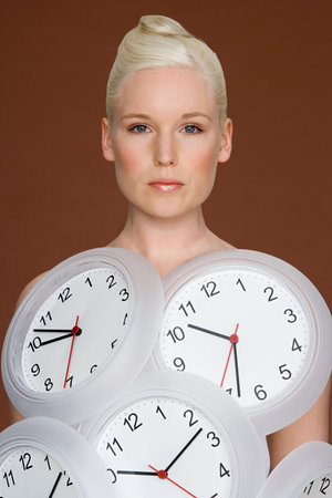Young woman wearing clocksの写真素材