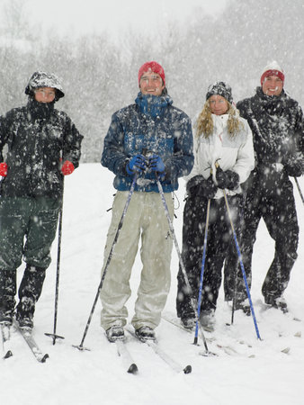 Four friends on skisの写真素材