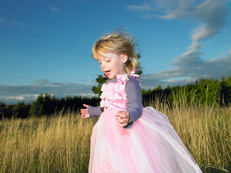 Girl With Princess Dress, In A Fieldの写真素材