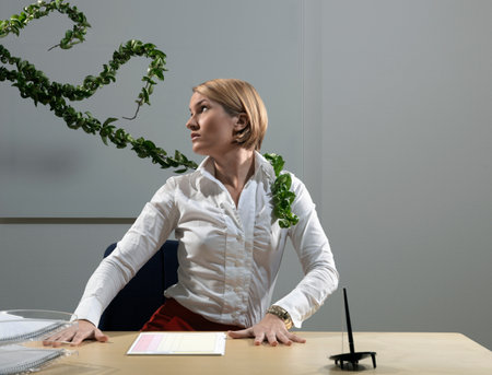 Woman By Desk Beeing Attacked By Plantsの写真素材
