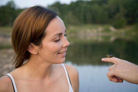 Woman Looking At Frogの写真素材