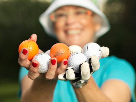 Mature Lady With Golf Ballsの写真素材