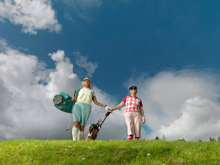Mature Ladies Playing Golfの写真素材