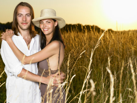 Couple At Sunset, In A Fieldの写真素材