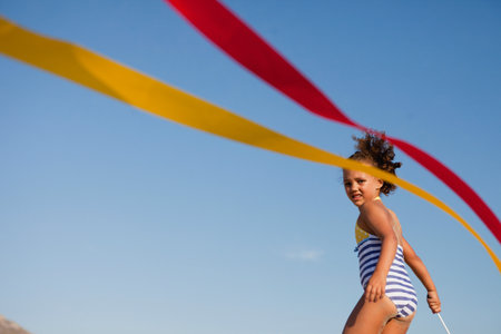 Young Girl Playing On Beachの写真素材