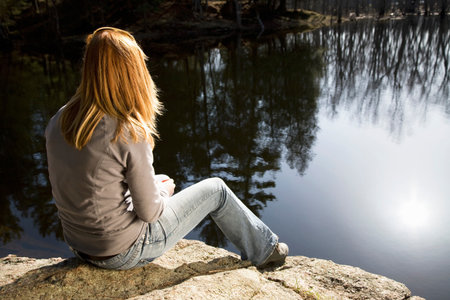 Woman Looking At Lakeの写真素材