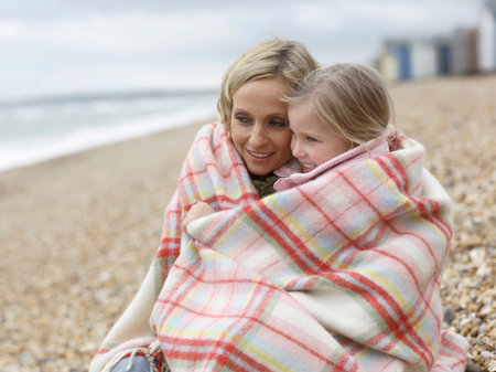 Mother And Daughter Together On Beachの写真素材