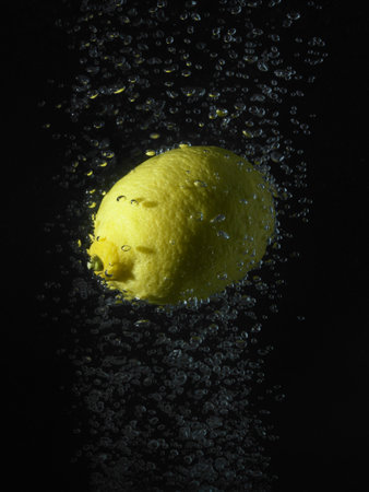 Lemon In Bubbles, Black Backgroundの写真素材