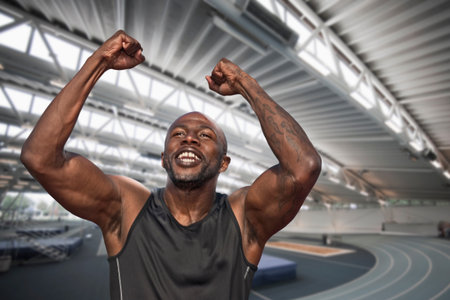 Athlete Celebrating With Arms Held Highの写真素材