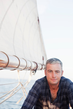 Man On A Sailing Boat Looking At Viewer