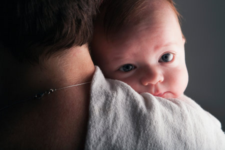 Young Baby On Mother's Shoulderの写真素材