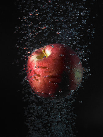 Apple In Bubbles, Black Backgroundの写真素材