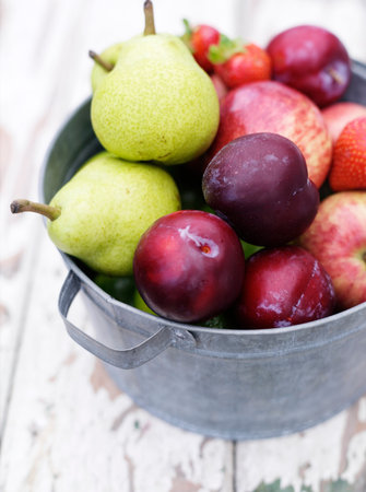 Close Up Of Bucket Of Fruitの写真素材