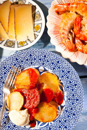 Plates Of Cheese, Prawns And Potatoesの写真素材