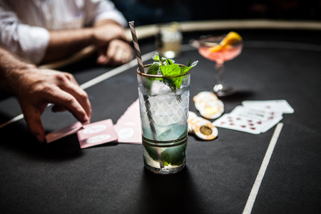 Cropped Image Of Gambling Table With Playing Cards, Chips And Cocktails
