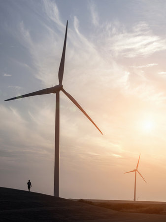 Man Strolling Near Wind Turbines And Eastern Scheldt Storm Surge Barrier, Designed To Protect The...