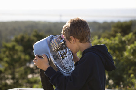 Boy Using Coin Operated Binoculars