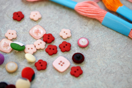 Buttons And Embroidery Thread On Benchの写真素材