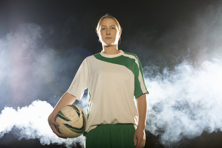 Female Soccer Player With Ballの写真素材