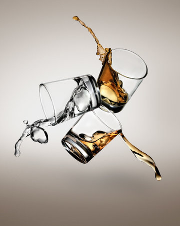 Three Glasses With Spirits Spilling Out