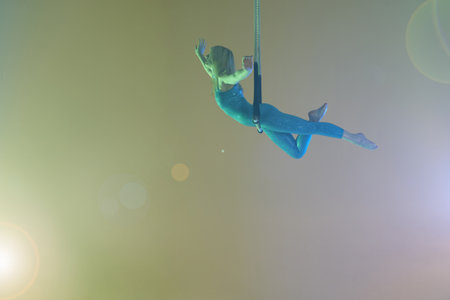Trapeze Artist Balancing On Trapezeの写真素材