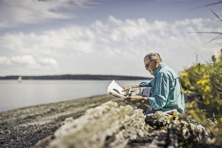 Senior Man Reading Newspapers, Port Townsend, Washington, Usの写真素材