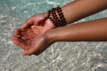 Close Up Of Hands Holding Water On Beach, Paradise Island, Nassau, Bahamasの写真素材