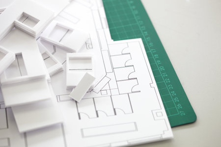 Close Up Of Interior Design Blueprint On Cutting Board