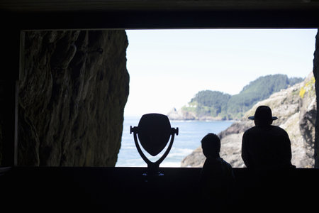 Father And Son In Sea Lion Caves, Oregon, Usaの写真素材