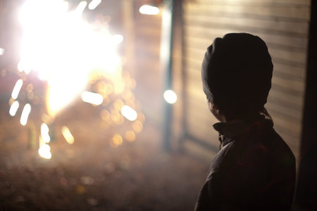 Boy Watching Fireworksの写真素材