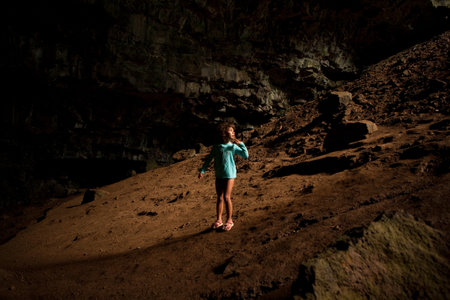 Girl In Dark Caveの写真素材