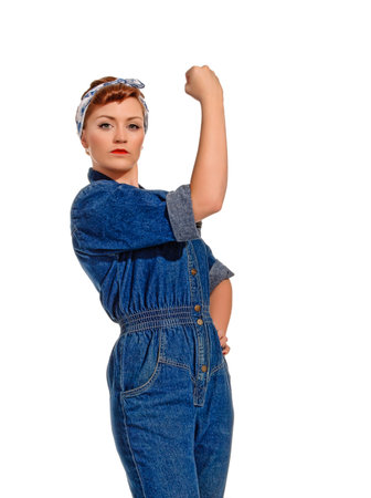 Retro-Styled Young Woman Flexing Muscleの写真素材