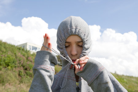 Teenage Girl Wearing Grey Hooded Topの写真素材