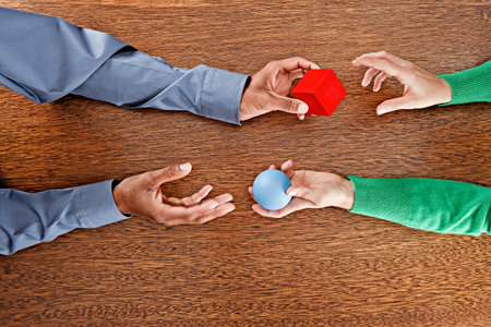 People Exchanging Colourful Shapesの写真素材