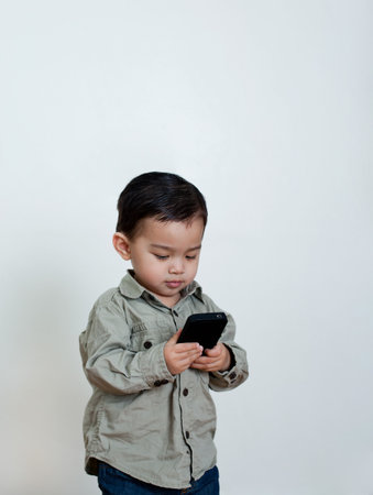 Young Boy Using Cellphoneの写真素材