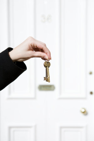Woman Holding House Keysの写真素材