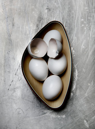 Eggs And Egg Shells In Bowl