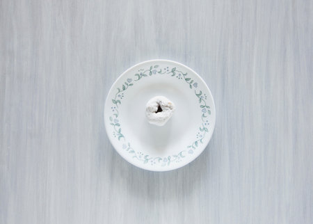 Powdered Donut On A Plateの写真素材