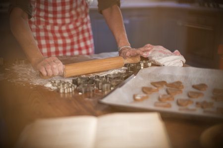 Rolling Cinnamon And Honey Dough To Make Homemade Cookiesの写真素材