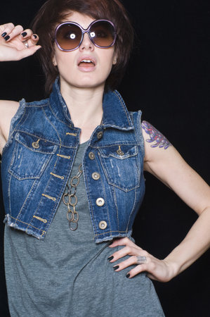 Portrait Of Mid Adult Woman Wearing Sunglassesの写真素材