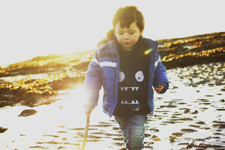 Boy On Troon Beach, Ayrshire, Scotlandの写真素材