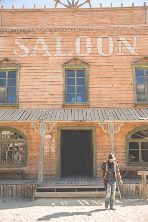 Cowboy In Front Of Saloon Building On Wild West Film Set, Fort Bravo, Tabernas, Almeria, Spain