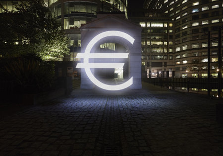 Glowing Euro Symbol In City Street At Night, London, Ukの写真素材